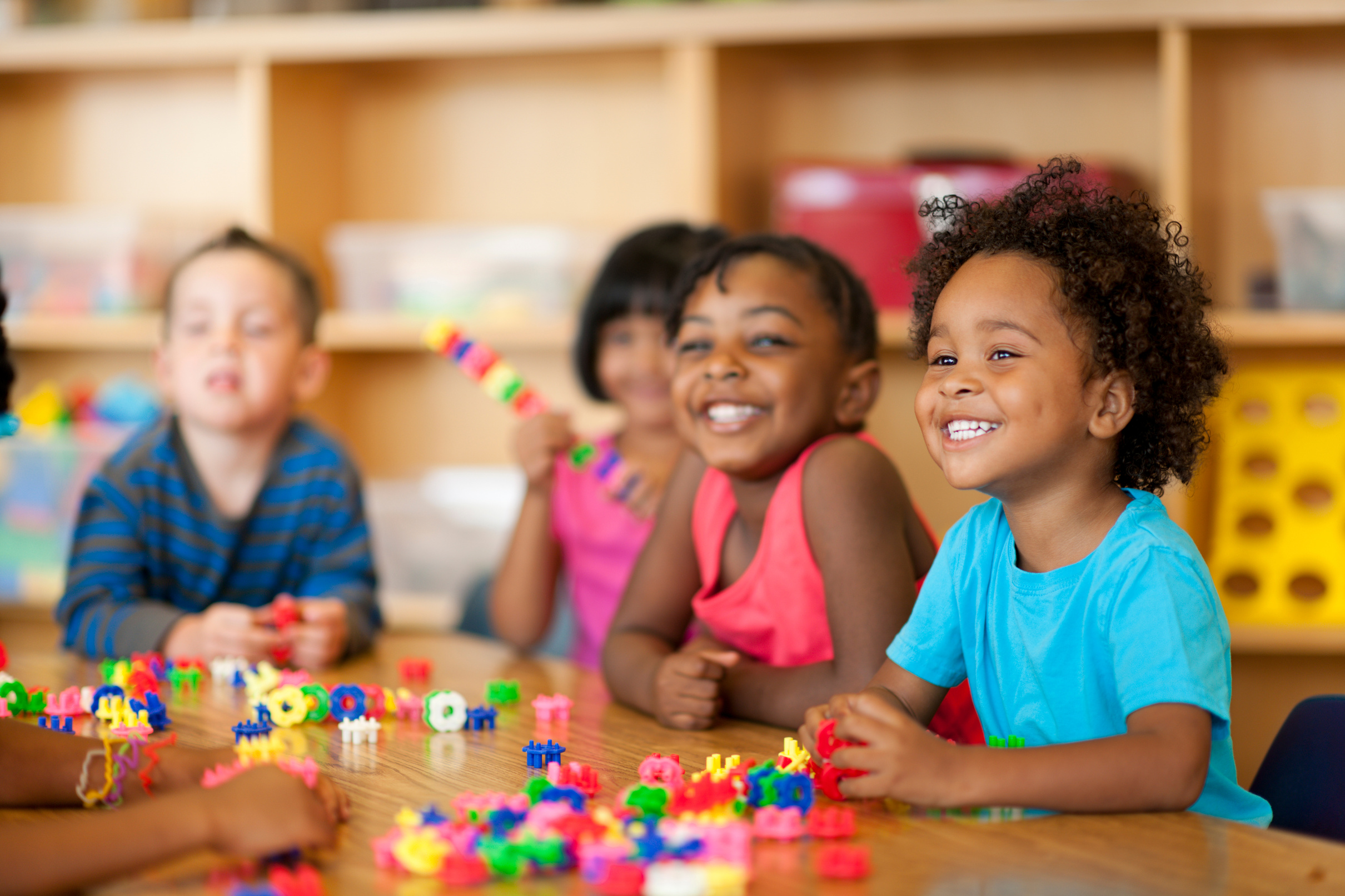 Teacher with diverse group of preschool children